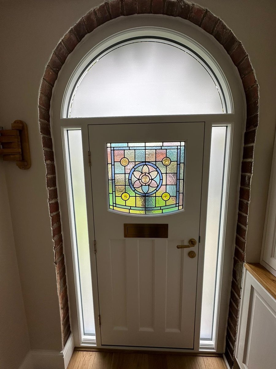 Curved head door with stained glass internal