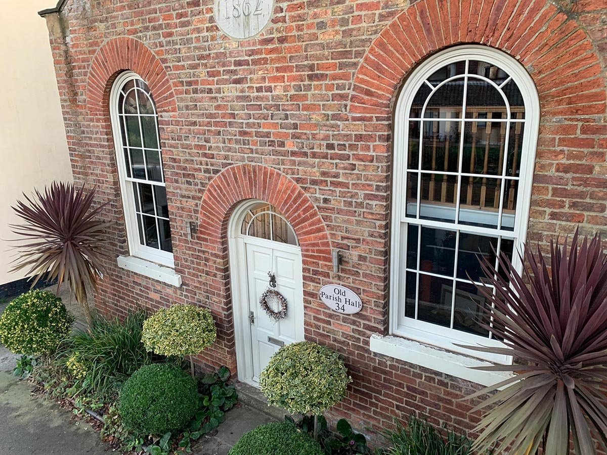 Curved headed sliding sash window